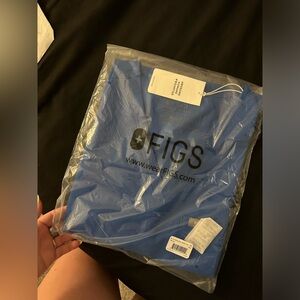 Figs royal blue one pocket scrub top. Bag never opened.